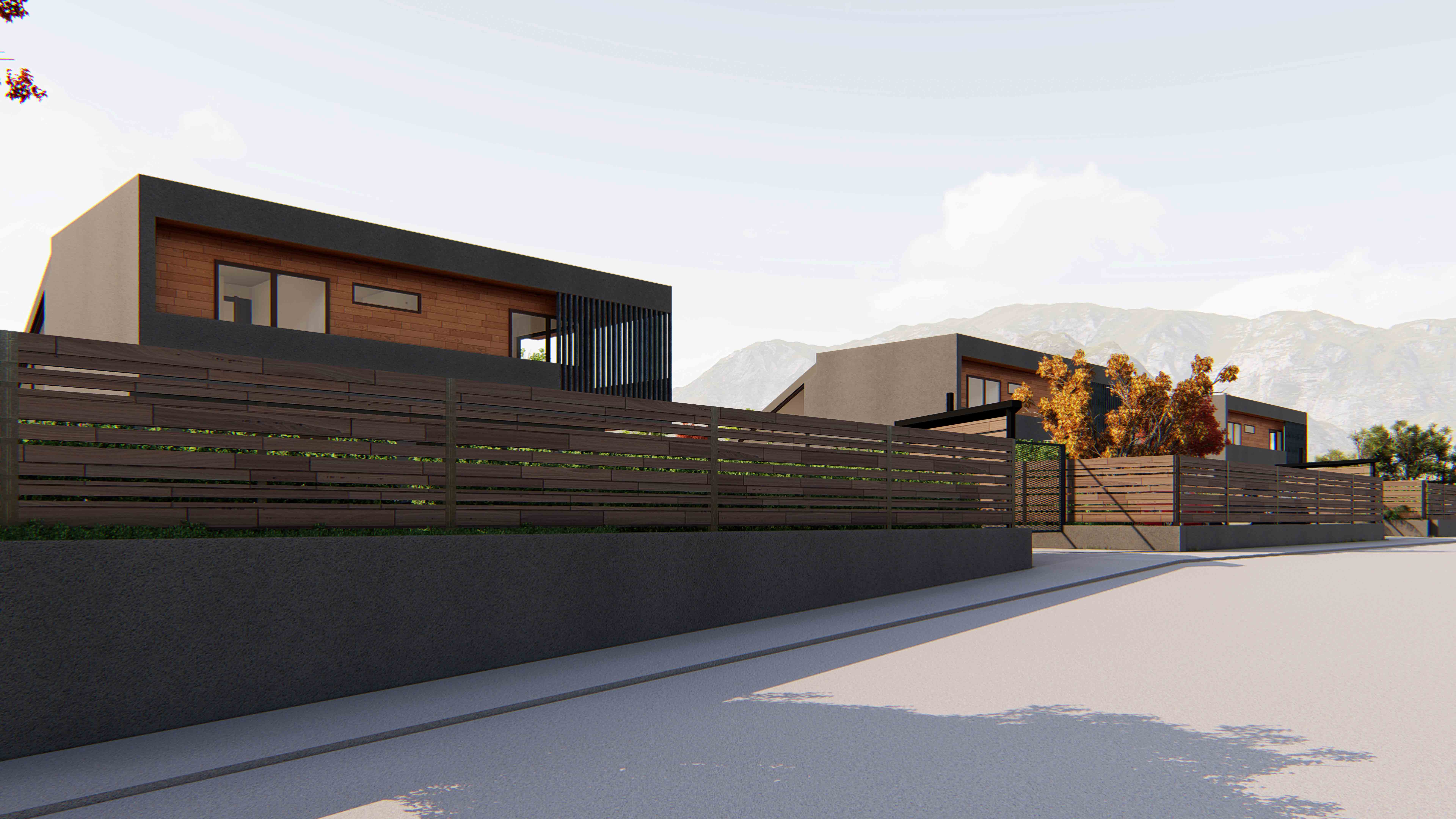 Casas del condominio vistas desde la calle, con cerco de madera