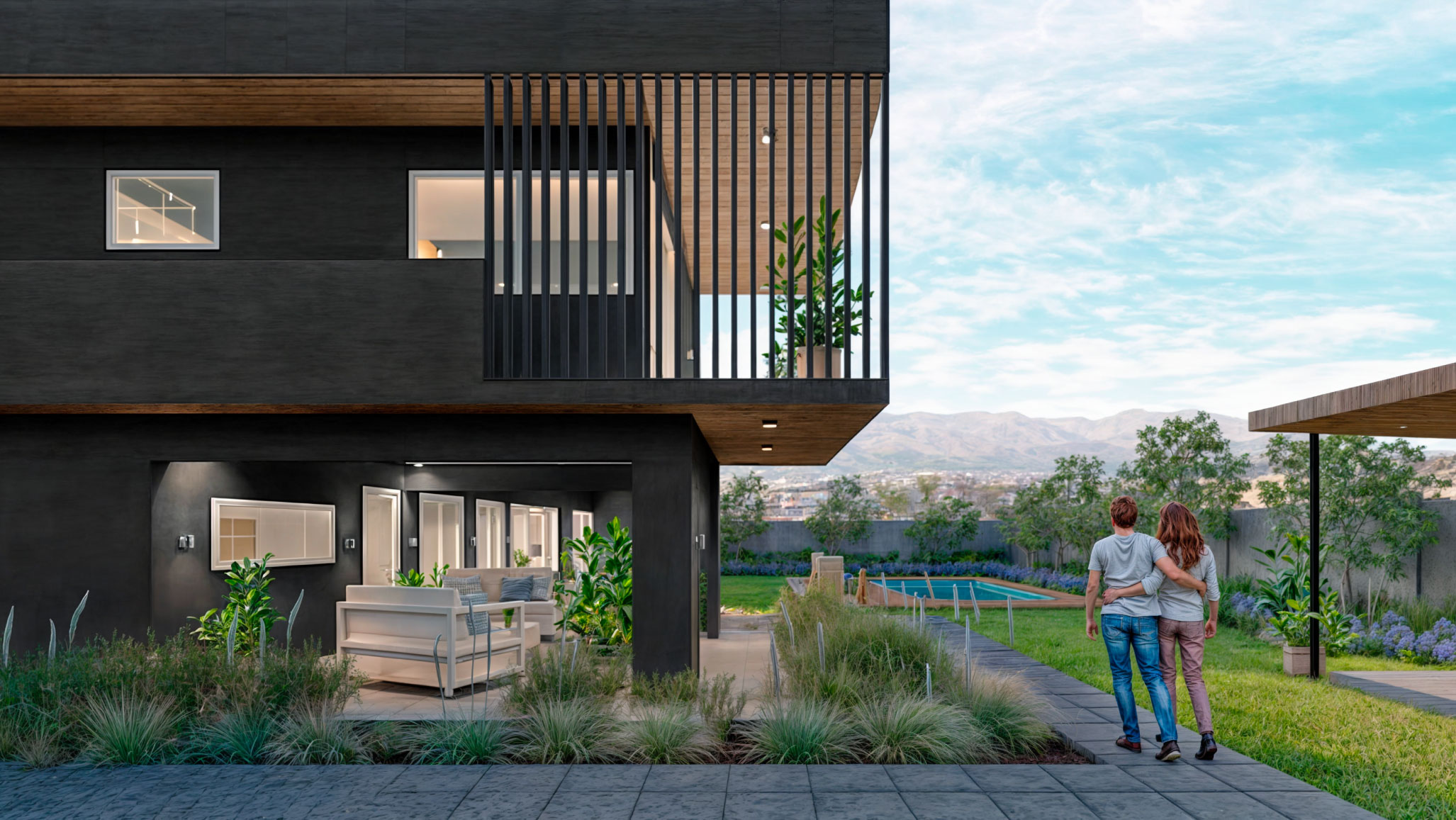 Casa DOS: Pareja caminando por el jardín frente a la fachada oscura de la casa, con la piscina al fondo